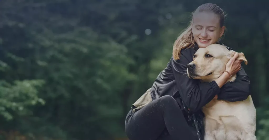 A woman huging her pet. We offer Pet Cremation & Burial Services Image